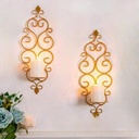 Wall-mounted candle holders with scrollwork design, golden metal, for weddings and parties